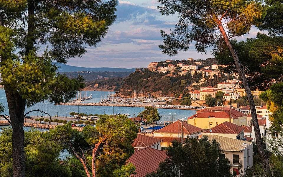 Greece with houses and sea on the background